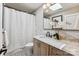 Bathroom featuring marble countertop, mosaic floor, and a skylight at 115 Forestcliff Ne Ct, Concord, NC 28025