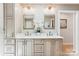 Elegant bathroom with double sinks, designer lighting, and stylish cabinets providing ample storage at 115 Forestcliff Ne Ct, Concord, NC 28025