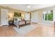 Bright bedroom with hardwood floors, large windows, and a neutral color palette at 115 Forestcliff Ne Ct, Concord, NC 28025
