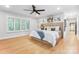 Spacious bedroom with hardwood floors, shutters, ceiling fan and an ensuite bathroom and walk-in closet at 115 Forestcliff Ne Ct, Concord, NC 28025