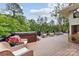 Relaxing outdoor deck with a hot tub, offering a perfect space to unwind and enjoy the picturesque views at 115 Forestcliff Ne Ct, Concord, NC 28025