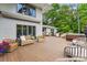 Spacious outdoor deck with comfortable seating, perfect for entertaining guests and enjoying the peaceful surroundings at 115 Forestcliff Ne Ct, Concord, NC 28025