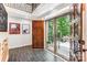 Inviting foyer with tile flooring, an ornate front door, large glass windows, and detailed trim work at 115 Forestcliff Ne Ct, Concord, NC 28025