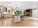 Gourmet kitchen with large island, stainless steel appliances, and a cozy fireplace at 115 Forestcliff Ne Ct, Concord, NC 28025