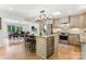 Spacious kitchen with island, stainless steel appliances, and adjoining dining area at 115 Forestcliff Ne Ct, Concord, NC 28025