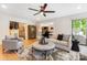 Inviting living room with fireplace, stylish decor, and access to outdoor patio at 115 Forestcliff Ne Ct, Concord, NC 28025