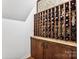 Wine storage featuring custom wooden wine racks and countertop at 115 Forestcliff Ne Ct, Concord, NC 28025