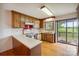 Eat-in kitchen features wood cabinets, a range oven, laminate countertops, and access to a deck at 1205 Southwood Dr, Newton, NC 28658