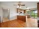 Kitchen view shows the sink and window, wood floors and cabinets, and an entry into another room at 1205 Southwood Dr, Newton, NC 28658