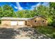 Brick home with a two-car garage, set on a sunny lot with large, mature trees at 1491 Cedar Grove Rd, Clover, SC 29710
