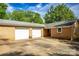 Two-car garage is attached to this brick home, with access from a large concrete driveway at 1491 Cedar Grove Rd, Clover, SC 29710