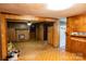 A unique den with a fireplace, paneling, and access to other rooms at 1491 Cedar Grove Rd, Clover, SC 29710