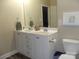 Bright bathroom featuring double sink vanity, with white cabinets, hardware, and fixtures at 1502 Mulberry Ridge Dr # 1, Newton, NC 28658