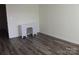 Minimal bedroom featuring a white desk, modern flooring, and neutral paint creating a calming atmosphere at 1502 Mulberry Ridge Dr # 1, Newton, NC 28658