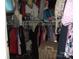 Walk-in closet with a variety of clothing hanging on rods and items on shelving at 1502 Mulberry Ridge Dr # 1, Newton, NC 28658