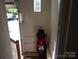 Entryway from the garage featuring ceramic tile flooring and a golf bag at 1502 Mulberry Ridge Dr # 1, Newton, NC 28658
