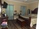 Relaxing main bedroom features a dark wood bedframe and ensuite bathroom at 1502 Mulberry Ridge Dr # 1, Newton, NC 28658