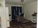 Home office with hardwood floors, a modern desk setup, and storage space at 1502 Mulberry Ridge Dr # 1, Newton, NC 28658