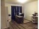 Home office with hardwood floors, a modern desk setup, and storage space at 1502 Mulberry Ridge Dr # 1, Newton, NC 28658