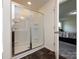 Bathroom featuring a walk-in shower with glass door at 1523 Loropetalum Rd, Charlotte, NC 28215
