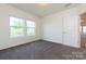 Well-lit bedroom featuring two large windows and a neutral color scheme at 1523 Loropetalum Rd, Charlotte, NC 28215