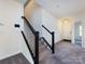 Bright entryway featuring a staircase with dark wood and white railings and a modern touchscreen control at 1523 Loropetalum Rd, Charlotte, NC 28215