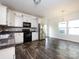 Kitchen featuring stainless steel appliances, granite counters, and an eat-in area at 1523 Loropetalum Rd, Charlotte, NC 28215