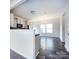 Bright living area with kitchen and dining space, showcasing modern design at 1523 Loropetalum Rd, Charlotte, NC 28215