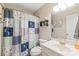 Practical bathroom with decorative shower curtain, toilet, sink, and vanity at 1542 Crowders Woods Dr, Gastonia, NC 28052