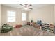 Versatile bedroom featuring two windows and neutral carpeting, ideal for various uses at 1542 Crowders Woods Dr, Gastonia, NC 28052