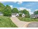 Beautiful home with a well-maintained lawn and an extended driveway at 1542 Crowders Woods Dr, Gastonia, NC 28052