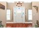 Grand foyer with decorative front door, high ceilings, hardwood floors, and ample natural light, creating an elegant entry at 1542 Crowders Woods Dr, Gastonia, NC 28052