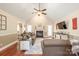 Inviting living room boasts a cozy fireplace, vaulted ceilings, and hardwood floors at 1542 Crowders Woods Dr, Gastonia, NC 28052