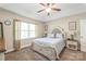 Serene main bedroom featuring a tray ceiling, soft lighting, and neutral tones, creating a comfortable and relaxing retreat at 1542 Crowders Woods Dr, Gastonia, NC 28052