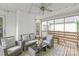 Cozy screened porch with comfortable seating and string lights, perfect for outdoor relaxation and entertaining at 1542 Crowders Woods Dr, Gastonia, NC 28052