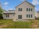 Spacious backyard with grass, a concrete patio, and a view of the home's exterior at 15923 Prescott Hill Ave, Charlotte, NC 28277