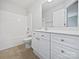 Clean, well-lit bathroom features a shower-tub combo, a toilet, and vanity with ample storage at 15923 Prescott Hill Ave, Charlotte, NC 28277