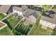 Aerial view of a home featuring a well-manicured lawn and stone patio area at 16134 Kelby Cv, Charlotte, NC 28278