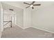 Spacious bedroom with neutral walls, ceiling fan and carpet at 16134 Kelby Cv, Charlotte, NC 28278