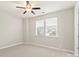 Comfortable bedroom with carpet, a ceiling fan, and natural light at 16134 Kelby Cv, Charlotte, NC 28278