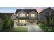 Charming two-story home featuring a welcoming front porch and a well-manicured lawn at 16134 Kelby Cv, Charlotte, NC 28278