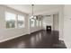 Expansive living room with many windows and fireplace, creating a warm and inviting atmosphere at 16134 Kelby Cv, Charlotte, NC 28278