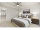 Bright main bedroom with tray ceiling, neutral colors and carpeting at 16134 Kelby Cv, Charlotte, NC 28278