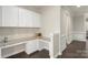 Functional home office space featuring granite countertops, custom cabinetry, and stylish design at 16134 Kelby Cv, Charlotte, NC 28278
