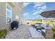 Relax in style with an outdoor patio featuring comfortable seating and a gas grill at 16134 Kelby Cv, Charlotte, NC 28278