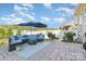 Beautiful stone patio area with outdoor seating and landscaping at 16134 Kelby Cv, Charlotte, NC 28278