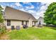 Backyard with grassy lawn, patio, and mature trees at 1835 Montague Rd, Clover, SC 29710