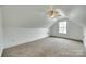 Spacious attic bedroom with a dormer window, carpeting, and sloped ceilings at 1835 Montague Rd, Clover, SC 29710