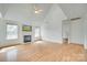 Bright living room with fireplace, high ceilings, wood floors, and large windows at 1835 Montague Rd, Clover, SC 29710