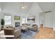 Bright living room features a fireplace, vaulted ceiling, and large windows for ample natural light at 1835 Montague Rd, Clover, SC 29710